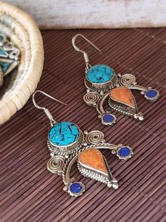 Turquoise and Coral Earrings - Tibetan Style Traditional Blue Danglers For Pierced Ears, Traditional Blue Danglers, Blue Fusion Danglers For Gift, Blue Metal Earrings For Festive Occasions, Fusion Blue Earrings For Festivals, Bohemian Turquoise Jewelry With Artistic Design, Handmade Turquoise Earrings For Festive Occasions, Handmade Blue Drop Earrings, Traditional Multicolor Pierced Earrings