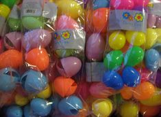 many different colored plastic eggs in bags