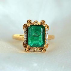 Emerald Ring Vintage, Real Emerald Ring & Diamond For Women, 14k Emerald Solitaire Wedding Ring, 3Ct Octagon Emerald Cut Stacking Ring Gift This ring features a stunning 3 Carat Natural Dark Emerald from Zambia framed by two baguette diamond moissanite and round diamond moissanite. This ring looks more beautiful in real with all vintage vibe. Available in 14K solid yellow gold & 18k Gold plated over silver. This ring acts as a perfect birthstone stacking ring, or a beautiful  & unique gift for w Heirloom Moissanite Ring In Emerald Cut, Heirloom Moissanite Emerald Cut Diamond Ring, Heirloom Moissanite Emerald Cut Ring, Heirloom Moissanite Ring Emerald Cut, Heirloom Emerald Cut Moissanite Ring, Exquisite Emerald Cut Ring With Accent Stones, Exquisite Emerald Cut Emerald Ring With Accent Stones, Exquisite Emerald Cut Ring For Promise, Exquisite Emerald Cut Emerald Ring