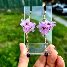 Beautiful and one of a kind , simple and affordable these earrings will be a great addition to your outfit , the earrings would be great at a wedding matching your lavender dress Trendy Single Flower-shaped Earring, Trendy Single Flower Shaped Earring, Flower Charm Earrings For Party, Dangle Flower Earrings As Gift For Her, Delicate Nickel-free Earrings As Gift For Her, Purple Dainty Earrings With Ear Wire, Dainty Purple Earrings With Ear Wire, Party Flower Charm Dangle Earrings, Flower Charm Drop Earrings For Party