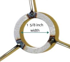 an image of a metal object that is in the shape of a circle with one end pointing