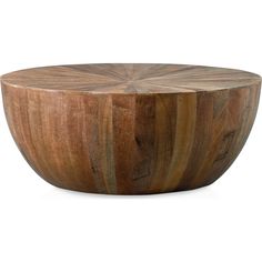 a wooden bowl sitting on top of a white surface