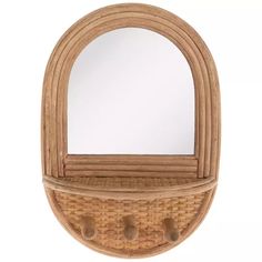 a wooden mirror and shelf with hooks on it