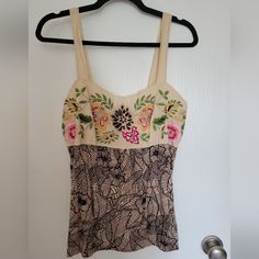 Never Worn Embroidered Tank Top From Anthropologie Size L. Perfect Summer Tank! I Don't Know The Brand. It's Not On The Tag. The Back Has Smocking For Stretch. Please Don't Hesitate To Ask Any Questions. I'm Happy To Answer. Thanks For Looking! Fitted Embroidered Beige Top, Fitted Embroidered Top For Summer, Beige Floral Embroidered Beach Top, Fitted Cream Tops With Floral Embroidery, Beige Floral Embroidery Tops For Beach, Beige Floral Embroidered Tops For Beach, Cream Embroidered Top For Summer, Cream Tops With Intricate Embroidery For Summer, Fitted Top With Intricate Embroidery For Summer