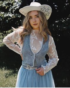 Wild Rose Bohemian Western Lace Top. Long sleeve layering blouse with mock neckline, sheer floral embroidery throughout, stretchy fit, and soft white vintage color.  Feminine and dainty addition to any sleeveless vest or cropped or plunge neckline tops for a dreamy feel and more coverage.  Perfect for lovers of western bohemian style. Make it your choice for a rodeo, bridal cowgirl look, girl's nights,music festivals, trips to Vegas and much more for a unique top that flatters and softens like n Spring Lace Patchwork Tops, Spring Sheer Lace Top For Layering, Spring Layering Lace Top, Sheer Lace Top For Spring Layering, Feminine Lace Top With Sheer Sleeves For Spring, Spring Lace Top With Lace Sleeves For Layering, Fall Lace Top With Patchwork For Layering, Fitted Floral Embroidered Lace Top For Spring, Spring Blouse With Sheer Sleeves For Layering