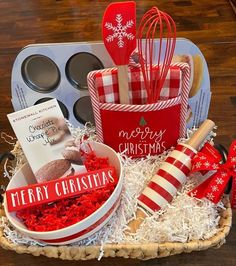 a basket filled with christmas treats and baking utensils on top of a table