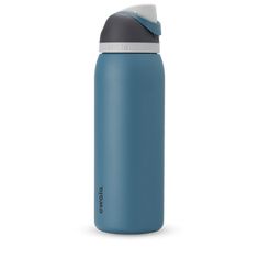 thermos stainless steel water bottle is blue and has a white cap on it