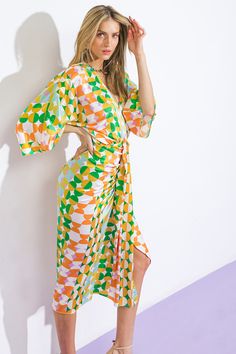 A printed woven satin midi dress featuring plunging V neckline, kimono sleeve, body contouring skirt with front detailDetails:Self: 97% Polyester 3% SpandexSize & Fit- Model is 5`8" And Wearing Size Small- Measurements Taken From Size Small- Approx. Length: 49" Retro V-neck Midi Dress For Summer, Green V-neck Wrap Dress For Spring, Vibrant Print V-neck Midi Dress For Party, Vibrant Print V-neck Maxi Dress For Brunch, Spring Beachwear Wrap Dress, Summer V-neck Wrap Dress Beachwear, Summer V-neck Beachwear Wrap Dress, V-neck Wrap Dress For Summer Beachwear, Spring Multicolor Midi Dress With Surplice Neckline