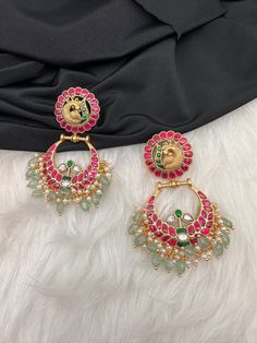 Peacock Red Green Jadau Kundan Chandballi Earrings screwback earringsColor : GoldenSize : Length :2.75 Inches; Weight :25 grams eachStones : Green Jadau Kundan Pearls Green Emerald Beads Traditional Green Kundan Chandbalis, Red Kundan Jewelry With Peacock Design, Festive Green Kundan Earrings, Festive Green Kundan Pearl Earrings, Festive Dual-tone Kundan Earrings, Emerald Bead, Emerald Green, Indian Jewelry, Red Green