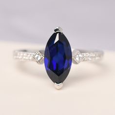 All HANDMADE ITEMS SHIP IN APPROX 8 DAYS Main Stone: Lab sapphire Main Stone Size: Marquise cut 6 mm x 12 mm Main Stone Weight: 2.19 carat Side Stone: CZ Height From The Ring Setting Bottom(to gemstone top): about 5.95 mm Width of Ring band Measure: gradually varied,about 2.1 mm Material: 925 Sterling Silver/14K White Gold/14K Yellow Gold/14k Rose Gold Engraved: Available For FreeNo more than 13 letters) Customized:Of course! Tell me what you want Includes With Order: All of my store items come Marquise White Gold Sapphire Ring, White Gold Marquise Sapphire Ring, Marquise Cubic Zirconia Sapphire Ring For Anniversary, Marquise Sapphire Ring With Diamond Cut For Anniversary, Marquise Sapphire Ring In White Gold For Anniversary, Marquise White Gold Sapphire Ring For Anniversary, White Gold Marquise Sapphire Ring For Anniversary, Sapphire Promise Ring With Marquise Cut, Marquise Sapphire Promise Ring In White Gold