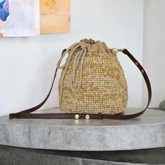 Handcrafted Raffia Crochet Drawstring Pouch | Versatile Shoulder & Crossbody Bag Discover the perfect blend of style and functionality with our handcrafted raffia crochet drawstring pouch. This stunning piece combines the natural charm of a straw bag with the practicality of a crossbody and shoulder bag, making it a must-have accessory for any occasion. Natural Raffia Elegance: Made from eco-friendly raffia, this pouch captures the essence of sustainable fashion with a lightweight and durable de Travel Bucket Bag With Weaving, Casual Woven Hobo Pouch Bag, Casual Woven Hobo Bag In Pouch Shape, Casual Handmade Beige Bucket Bag, Beige Pouch Straw Bag With Adjustable Strap, Natural Woven Bucket Bag For Daily Use, Beige Crochet Bucket Bag With Braided Handles, Casual Handwoven Bucket Bag, Casual Beige Handwoven Bucket Bag