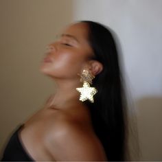 Meet our Star earrings from the Holiday Collection. Your perfect pair of statement earrings for NYE and holiday parties. Styling tip: wear this with an elegant black gown. Gold Plating with CZ Stone. Clip on earrings. Elegant Black Gown, Gown Gold, Black Gown, Star Earrings, Cz Stone, Holiday Collection, Gold Plating, Holiday Parties, Clip On