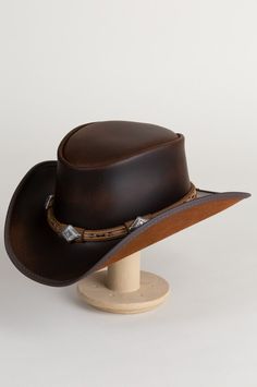 Laramie Leather Cowboy Hat with Conchos | Overland Rugged Leather Hats For Western-themed Events, Vintage Leather Hat For Western-themed Events, Vintage Leather Fedora For Rodeo, Leather Hats For Country Events In Distressed Brown, Distressed Brown Leather Hats For Country Events, Leather Distressed Brown Hats For Country Events, Western Leather Hat In Distressed Brown, Rugged Leather Hat Bands For Ranch, Distressed Brown Leather Hat For Rodeo