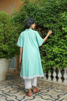 Dusty jade kurtapant set is perfect for a festive season or a day out .Cotton cambric fabric makes it perfect for summer weather. Front v-neckline kurta with lace detail bell sleeves give a classic look. Product has no lining. Pant has two side pockets, back elasted waistband and lace on the hem. Cold wash and Dry clean only.Type of Work: Solid Fit: Loose Model Height: 5'7 Measurements: Kurta-36.5" Pant- 34" SKU#: 11702071GR Disclaimer: There may be slight difference in actual product color comp Green Festive Pant Set For Spring, Summer Chikankari Embroidery Straight Kurta Pant Set, Green Chikankari Embroidered Palazzo Set For Summer, Casual Sets With Chikankari Embroidery For Summer, Traditional Green Pant Set For Spring, Green Straight Kurta Pant Set For Spring, Summer Sets With Chikankari Embroidery Unstitched, Cotton Sets For Summer Festivals, Summer Festive Cotton Sets