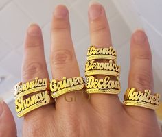 A name ring is a unique and personal way to express your identity and style. Whether you want to wear your own name, a loved one's name, or a meaningful word, you can customize your ring with up to 10 letters in a beautiful script font. The ring is made of high-quality sterling silver with a choice of gold or rose gold overlay for a stunning finish. The ring comes in a lovely gift box and is available in different sizes. A name ring is a perfect gift for yourself or someone special on any occasi Customized Nameplate Rings For Anniversary, Custom Nameplate Rings For Promise, Custom Name Nameplate Ring For Promise, Custom Nameplate Ring For Promise, Promise Ring With Custom Nameplate, Custom Name Plate Ring For Promise, Customized Gold Engraved Promise Ring, Customizable Nameplate Promise Ring, Silver Nameplate Ring With Custom Name