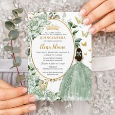 a woman holding up a card with flowers and leaves on it, in front of a sequin background