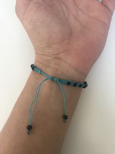 "SPECIAL OFFER!! Buy TWO get ONE for FREE!! of equal or lesser value (please, don't add your free product to your shopping cart or you will be charged for it. Pick 1 product and leave the full name of it in the \"Note to enjoywelrydesign\" Box during checkout.) This is a turquoise macrame bracelet with black crystal beads. Protect yourself from selfishness and negativity with this Kabbalah bracelet. The simplicity of this bracelet make it easy to match. And also very elegant. The bracelet is adj Casual Adjustable Beaded Crystal Bracelet, Black Beaded Spiritual Friendship Bracelets, Adjustable Black Hand-strung Friendship Bracelets, Adjustable Spiritual Friendship Bracelets, Adjustable Spiritual Friendship Bracelets As Gifts, Spiritual Black Beaded Friendship Bracelets, Black Spiritual Friendship Bracelets Adjustable, Black Beaded Friendship Jewelry, Black Beads Jewelry For Friendship