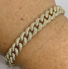 "Beautiful Pave Link Bracelet Yellow Gold set with sparkling diamonds.  Feels nice and solid 22.72 grams of solid gold.  The back of the bracelet is smooth shiny gold. This bracelet is like a buy one get one free.  Lol. You can wear the diamond side or flip the bracelet over and wear on the plain gold side on more casual days.  Measures 8mm width.  The lock is nice and secure with safety latch.  The diamonds are set nice and smooth.  Excellent craftsmanship.  7\" length.   Genuine earth mined round brilliant cut diamonds  Total weight: 3.85 Carats Clarity: SI/ I Color: G All shiny diamonds, no cloudy or yellowish stones  Solid 14K Gold 22.72 grams  Comes with gift box * We have been in the wholesale Jewelry business for over 30 years serving the community at the same location.  All diamond Luxury Yellow Gold Chain Bracelet With Single Cut Diamonds, Gold Diamond Cut Bracelet, Yellow Gold Diamond Cuban Link Bracelets, Cuban Link Gold Bracelet With Diamonds, Gold Diamond Cut Bracelet With Dazzling Style, Gold Diamond Cut Dazzling Bracelet, Dazzling Gold Diamond Cut Bracelet, Luxury Iced Out Yellow Gold Diamond Bracelet, Gold Cuban Link Tennis Bracelet With Diamond Accents