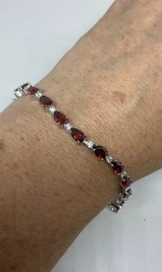 Vintage Bohemian Red Garnet and Cubic Zirconia Bracelet 925 Sterling Silver bracelet is very lively and bright.   The stones are deep colors and well matched.   The sterling silver is plated with rhodium to protect the bracelet from tarnish This is 7.5 inch My jeweler can shorten for a $20 fee.  All jewelry is shipped free in the US in a nice gift box.   Check out our over a THOUSAND great reviews Engraving is $4 per letter and is not always perfect depending on the piece. It can take a few days Red Cubic Zirconia Bracelets For Anniversary, Red Cubic Zirconia Bracelet With Gemstone, Fine Jewelry Red Cubic Zirconia Tennis Bracelet, Red Cubic Zirconia Tennis Bracelet With Gemstones, Red Cubic Zirconia Tennis Bracelet, Red Gemstone Tennis Bracelet For Anniversary, Red Cubic Zirconia Fine Jewelry Bracelet, Red Cubic Zirconia Tennis Bracelet For Anniversary, Anniversary Red Gemstone Tennis Bracelet