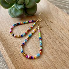 Elevate Your Style with Hand-Beaded Colorful Teardrop Earrings Infuse a pop of vibrant color into your ensemble with our hand-beaded teardrop earrings. Each piece is meticulously crafted with tiny seed beads, creating a stunning accessory that effortlessly combines elegance with a playful touch. ✨ Key Features: Burst of Color: Add a touch of joy to your ears with the lively hues of our hand-beaded teardrop earrings. The intricate beadwork is a testament to the craftsmanship that goes into each p Everyday Multicolor Teardrop Jewelry, Multicolor Dangle Earrings For Everyday, Teardrop Earrings Gift, Colorful Teardrop Jewelry As Gift, Everyday Multicolor Dangle Earrings, Multicolor Teardrop Jewelry For Crafting, Gift Teardrop Earrings With Colorful Beads, Colorful Beaded Dangle Teardrop Earrings, Colorful Beaded Earrings With Dangling Beads For Gift