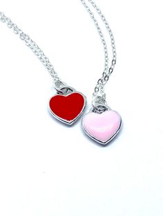 Description This tiny heart necklace is minimalistic and beautiful! Choose a pink or red heart as a symbol of your love that she can wear all the time. The heart hangs on a delicate sterling silver chain. Just choose the length. This necklace would make a lasting and memorable gift for Valentine’s Day, an anniversary, a birthday or anytime you want to let someone know they are loved! Connect Let’s stay in touch: Sign up for my VIP list for coupons, to be the first to see new releases and to be e Heart-shaped Friendship Necklaces With Adjustable Chain, Heart-shaped Adjustable Chain Necklace For Friendship, Heart-shaped Friendship Necklace With Adjustable Chain, Friendship Heart Necklace With Adjustable Chain, Friendship Necklace With Heart Pendant And Charm, Friendship Necklace With Heart Pendant, Valentine's Day Silver Charm Necklace With Delicate Chain, Tiny Charm Necklaces For Valentine's Day, Valentine's Day Necklace With Heart Charm For Friendship