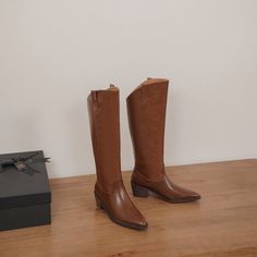 Looking for a stylish and sophisticated boot that will take your look to the next level? Then check out our Brown Block Heel Knee High Boots! These amazing boots are made from premium leather and feature a sleek pointed toe design. They're perfect for dressing up or down. and they'll add a touch of elegance to any outfit. Plus. the comfortable block heel makes them ideal for walking and standing all day. Upper: Leather/Suede Lining: Leather Outsole: TPR Toe: Pointed Toe Closure: Zip Heel: 5cm/2' Pointed Toe Boots For Fall Workwear, Western Style Heeled Boots For Fall Workwear, Fall Wide Calf Pointed Toe Knee-high Boots, Fall Knee-high Boots With Pointed Toe, Office Boots For Fall With Pointed Toe, Classic Pointed Toe Heeled Boots For Fall, Fall Faux Leather Pointed Toe Platform Boots, Classic Heeled Boots With Pointed Toe For Fall, Faux Leather Pointed Toe Wedge Boots For Fall