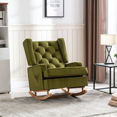 a green rocking chair in a living room