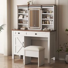 a white dressing table with a mirror and stool in front of it on top of a hard wood floor