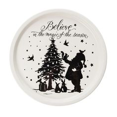 a white plate with an image of a person and a christmas tree