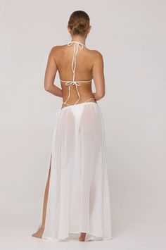 Athena Skirt in White – RESA Fitted Sheer Cover-up For Beach Party, Chic White Maxi Skirt For Beach, Chic White Maxi Skirt For The Beach, White Maxi Skirt For Beach, Chic Sheer Flowy Maxi Skirt, Chic White Wrap Skirt For Party, Elegant Summer Skirt With Tie Waist, Beach Breezy Flowy Maxi Skirt, Breezy Flowy Maxi Skirt For Beach