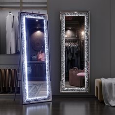 a large mirror sitting on top of a wooden floor