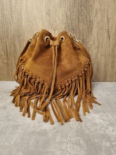 Soft Italian Real Suede Leather Brown Fringe Tassel Crossbody Bag/ Suede Leather Tan Shoulder bag Fringe bags/ Brown Suede Bags Gifts for her Drawstring Closure Internal zipped pocket  Gold tone metal hardware  Detachable /Adjustable strap Fully lined inside  Soft Italian Real Suede Leather  Dimensions: H25cm x L25cm x D15cm Brown Tassel Bags For Daily Use, Brown Fringe Bags For Daily Use, Brown Fringe Bag For Daily Use, Brown Fringe Shoulder Bag For Daily Use, Brown Fringe Bag, Daily-use Brown Bag With Fringe, Daily Use Brown Fringe Bag, Leather Travel Bag With Tassels, Brown Satchel Shoulder Bag With Tassels