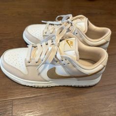 New Nike Dunks Beige And Gold Women’s Size 7 Or Men’s Size 5.5 (Comes With Box) Shoes Dunks Low, Cute Cheep Shoes, Cute Nike Dunks For Women, Nike Dunks Cream, Staple Sneakers For Women, Beige Shoes Women, Daily Shoes Women, Tan Nike Dunks, Women’s Nikes