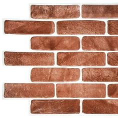 a brick wall made out of red bricks with white trim and brown grouting