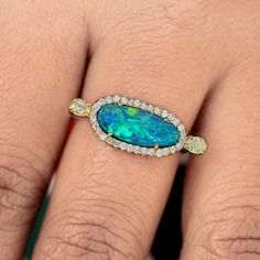 "\"Details: Item code :- ATR-2101 - 14K yellow solid gold (as shown) wt :1.88 gm - 0.47 ct diamonds - 1.03 ct opal - ring size 22 x 8 mm & 7 us size Anjis touch jewelry supports ethical and eco-friendly practices and uses reclaimed and recycled metals whenever possible About my jewelry: All of the Anjis touch jewelry collection is handmade exclusively by me.  I hope that you will enjoy wearing my designs as much as I enjoy making them! Shipping: All of my jewelry is made to order so please allow Yellow Gold Opal Ring With Halo, Yellow Gold Opal Ring With Halo Setting, Oval Yellow Gold Halo Ring Gia Certified, Yellow Gold Opal Diamond Ring, Yellow Gold Opal Ring With Diamond Center Stone, Gia Certified Yellow Gold Pear-shaped Jewelry, Gia Certified Oval Diamond Ring In 14k Gold, Gia Certified Pear-shaped Yellow Gold Jewelry, Gia Certified 14k Gold Oval Jewelry