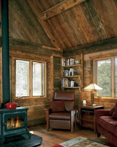 a living room filled with furniture and a fire place in front of a window covered in wood