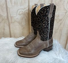 Everyone needs a pair of cheetah print cowboy boots in their closet! This Roper has a cheetah printed on faux brushed shaft and waxy brown full grain leather foot. Made for comfort, it has a REST comfort insole and dynamic arch support. 8 inch shaft height Leather lining  Double stitch welt Leather outsole  1 1/4 inch Square Toe Cowgirl Boots, Tan Square, Cowgirl Boots Square Toed, Cute Cowgirl Boots, Fringe Cowboy Boots, Cheetah Print Shoes, Square Toe Western Boots, Womens Cowgirl Boots, Western Shoes