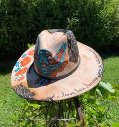 "FREEBIRD" Tan color hat, hand painted flowers, Falcon & "if i leave here tomorrow, would you still remember me ?" southwestern design 4" wide brim women's hat Includes removable hat band...hat has been burned & paint weathered.. burned fabric added for weathered distressed look...under hat has painted flowers  Make an any outfit stylish with this hand painted one of a kind walking art. Premium thick texture paint. Polyester material Size 59cm   Brim: 4" Hat Height 5"  Please read hat measuremen Artistic Hand Painted Sun Hat For Festivals, Artistic Hand Painted Adjustable Hats, Artsy Adjustable Fedora With Curved Brim, Hand Painted Short Brim Sun Hat For Festivals, Hand Painted Curved Brim Sun Hat For Festivals, Bohemian Hand Painted Sun Hat For Festivals, Artistic Hand Painted Wide Brim Sun Hat, Artistic Hand Painted Flat Brim Hat, Hand Painted Adjustable Hat Bands For Rodeo