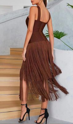 Wearing this brown sleeveless fringed maxi dress when going to the party will definitely make a lot of attention. This maxi dress looks really special. The sleeveless design shows the beautiful neck and round shoulders without stinginess. The cross design of the chest shoulder straps makes the original simple style unique. In order to make this dress look more sexy, a small hollow design was made on the chest to make the curves of the chest looming. The hem of the suspender dress is decorated wi Brown V-neck Maxi Dress For Festival, Brown Sleeveless Fringe Dress, Round Shoulders, Brown V-neck Dress With Ruffle Hem, Luxury Brown V-neck Maxi Dress, Brown V-neck Mini Dress With Ruffle Hem, Beautiful Neck, Bandage Dress Bodycon, Suspender Dress