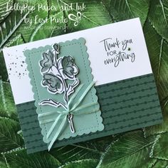 a close up of a card with leaves