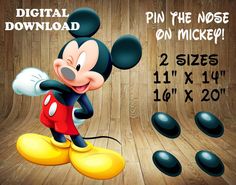 the mickey mouse is standing in front of some black and white balls with numbers on them