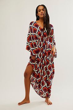 Billowy and breezy, vibrant and eye-catching, this so special kaftan is perfect for brunches, beach days, and everything in between. **Fit:** Maxi length, relaxed and oversized **Features:** Super mod, retro print, relaxed sleeves, pull-on style, deep-v neckline, ruched detailing, soft comfy fabrication **Why We | Groovy Baby Maxi Kaftan Dress by Free People in Yellow Flowy V-neck Kaftan For Day Out, Maxi Length Beachwear Cover-up For Brunch, Bohemian V-neck Kaftan For Brunch, Vibrant Print V-neck Kaftan For Beachwear, Beachy Flowy V-neck Kaftan, Chic Printed Beach Dress Cover-up, Chic Printed Beach Dress For Cover-up, Flowy Beachwear Maxi Dress For Brunch, Spring Beach Cover-up Breezy Kaftan