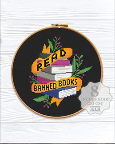 a cross stitch pattern with the words read, banned books and an image of a book