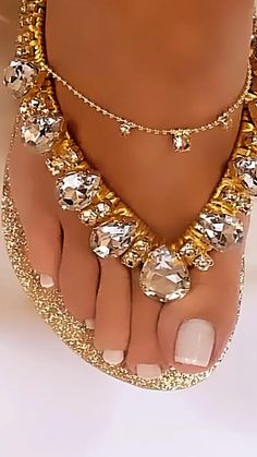 Gold Open Toe Sandals With Bling, Gold Bling Open Toe Sandals, Gold Glitter Sandals For Summer, Gold Sparkling Sandals For Summer, Gold Flip Flops For The Beach, Gold Rhinestone Flip Flops For Vacation, Elegant Gold Flip Flops For The Beach, Gold Glitter Sandals For The Beach, Elegant Gold Flip Flops For Beach