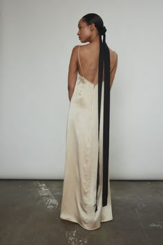 Description Minimal silhouette in silk satin. Maxi length with silk corded straps and self lined three part cup. Invisible zip closure at center back. Details - 100% Silk Charmeuse - Unlined body - Sustainably and ethically made in California - Model is 5'8 wearing size small Garment Measurements: Size Bust Waist Hip Length XS 32 28 38 45.5 S 34 30 40 46 M 36 32 42 46.5 L 38 36 44 47 XL 40 38 46 47.5 1X 42 40 48 48 Strapless Column Dress, Maxi Dress Styling, Slip Dress Silk, Trend Forecast, 2025 Wedding, Silk Slip Dress, Satin Maxi, Silk Charmeuse, Silk Slip