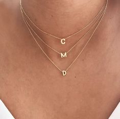 This stainless steel alphabet necklace is the perfect gift for any fashion-forward woman. The letters are available in gold or silver, adding a touch of elegance to any outfit. Made from high-quality stainless steel, this necklace is also water-resistant, ensuring a long-lasting fit. Its versatile design allows it to be worn alone or layered with other necklaces for a fashionable look. Deliver style with this stunning stainless steel women's alphabet necklace -Delivered with pouch. .Necklace len Tan Monogram Initial Pendant Necklace, Tan Initial Pendant Necklace, Stainless Steel Initials Name Necklace, Trendy Silver Jewelry With Initials, Sterling Silver Initial Pendant Necklace With Delicate Chain, Sterling Silver Initial Necklace With Delicate Chain, Dainty White Gold Initial Pendant Necklace, Dainty White Gold Necklace With Initial Pendant, Minimalist Silver Initial Pendant Necklace