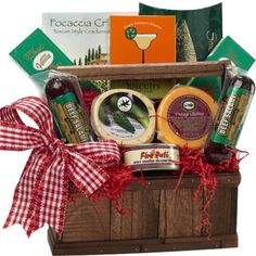 a gift basket with cheese, jams and condiments in the shape of a box