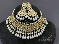 Statement Necklace| Moissanite Polki Necklace set|Indian Wedding Jewelry | Indian Traditional Jewelry set | Necklace Set Material : Silver Gemstone: Moissanite , Red Enamel Stone colour: Uncut polki Primary colour: Gold Size- Necklace length: 550mm Earring length: 65mm Width: 30mm Silver Intricate, hand crafted, Pure Silver Polki Necklace Set , studded with high quality Moissanite Polki Necklace made in 92.5 silver with 22ct gold plating. Product comes with 92.5 silver hallmark. - Product can be Heavy Dazzling Bridal Necklace For Wedding, Luxury Kundan Necklace With Elegant Design For Wedding, Luxury Elegant Kundan Necklace For Wedding, Exquisite Bridal Necklace For Wedding, Heavy White Jewelry For Formal Occasions, Dazzling Kundan Necklace For Wedding, White Stone Work Jewelry For Anniversary, Heavy White Bridal Necklace For Reception, Hand Set Round White Kundan Necklace