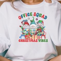 "Office Staff Christmas Shirt makes the perfect shirt for the School Office or Admin crew fthis holiday season! T-shirt: This is made with a Gildan 64000 unisex soft-style t-shirt. Made from very soft materials, this tee is 100% cotton for solid colors. Heather colors and sports grey include polyester. The shoulders have twill tape for improved durability. There are no side seams. The collar is made with ribbed knitting to prevent curling damage. *100% ring-spun cotton *Light fabric *Tear-away l Office Team, Office Staff, Holiday Apparel, The Office Shirts, Squad Shirt, Christmas 2024, Christmas Mugs, Cotton Lights, Perfect Shirt