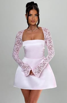 Ultra feminine and alluring, the Sadie mini in Blush is made for romantic dinner dates, garden parties and so much more. Cut from our premium satin fabric, the body of the dress features a square neckline and ultra cinched waist for the silhouette of dreams, contrasted by a voluminous bubble skirt. The look is complete with sheer lace sleeves with flared cuffs.



Colour: Blush.

Premium satin fabric.

Body of dress is fully lined.

Sheer lace sleeves.

Flared cuff to sleeve.

Tie at back should Cute Mini Dress With Sleeves, Semi Formal Silk Dress, A Cut Dresses, Fitted A Line Dress, Graduation Dresses Primary School, Dress To Wear On A Date, Dresses To Wear To Dinner, Sewing A Sleeve, Champagne Dress For Wedding Guest